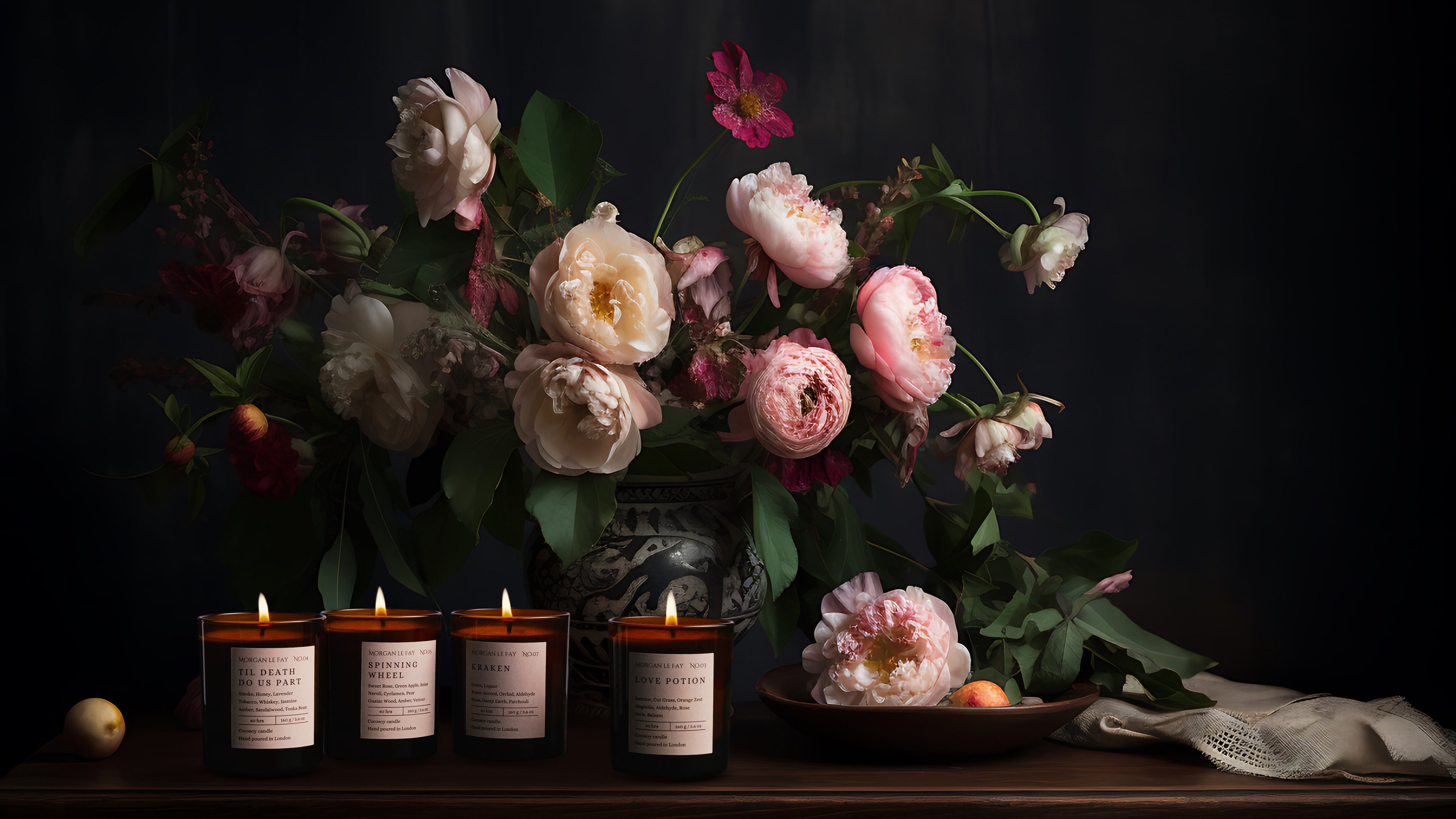Still life arrangement with flowers, candles, and a dark background